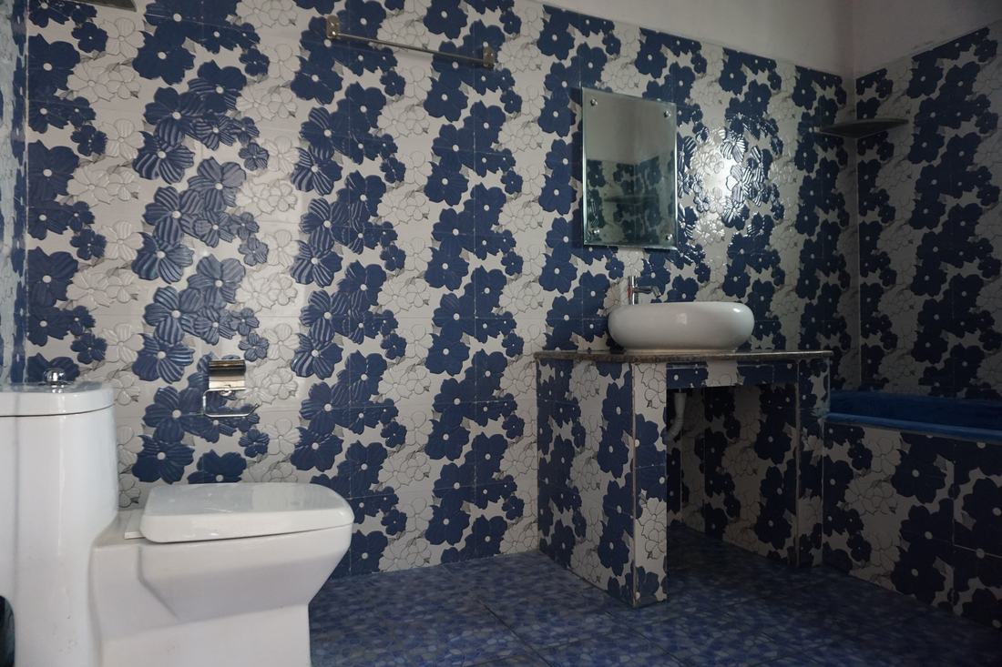 Prithvi room G1, Art Le Cafe Auroville — bathroom sink and toilet