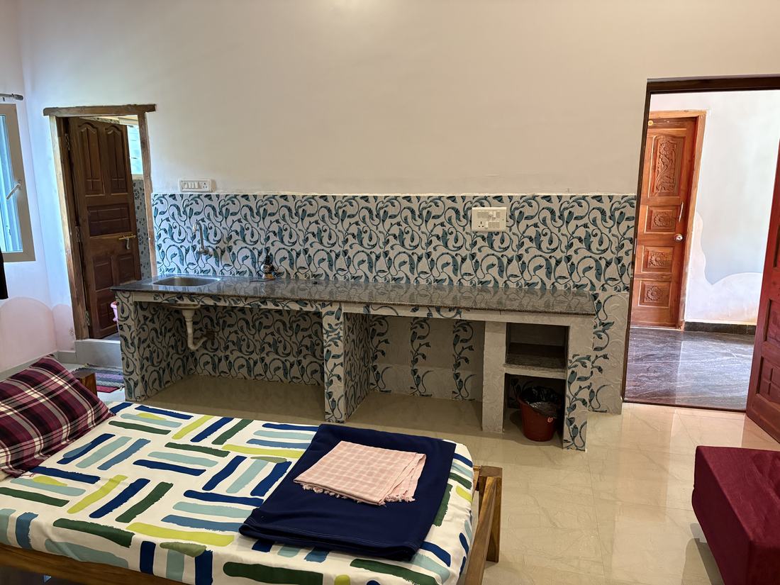 Agni room G3, Art Le Cafe Auroville — sink and worktop space