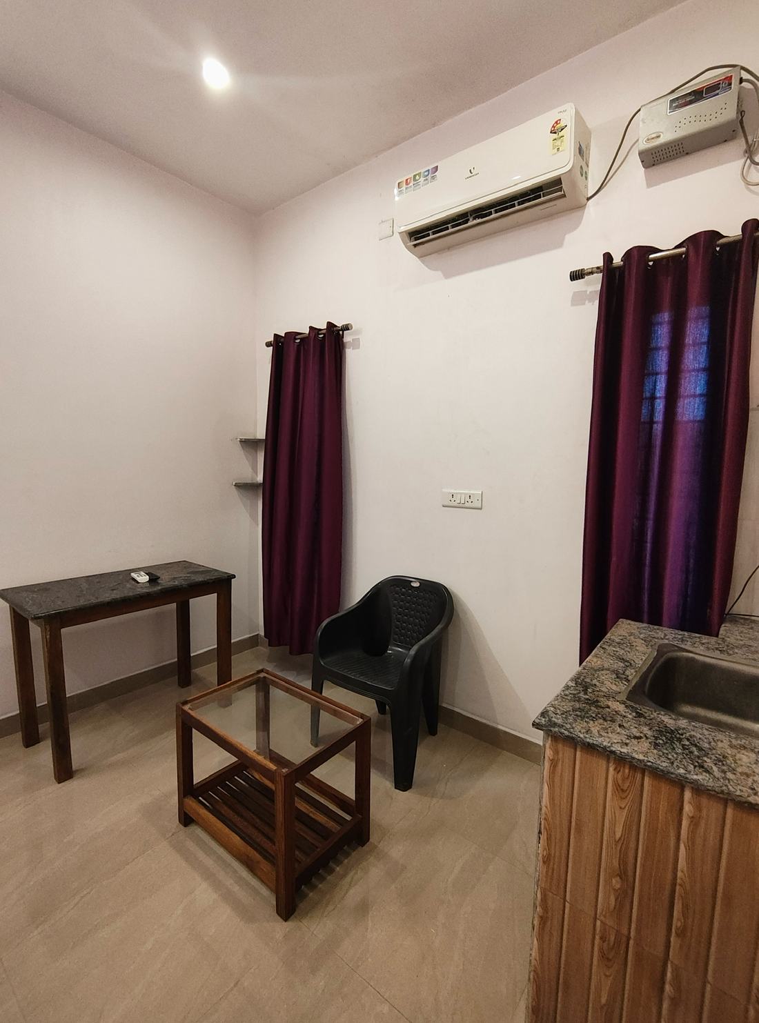 Aakash room G5, Art Le Cafe Auroville — table, chair and sink corner