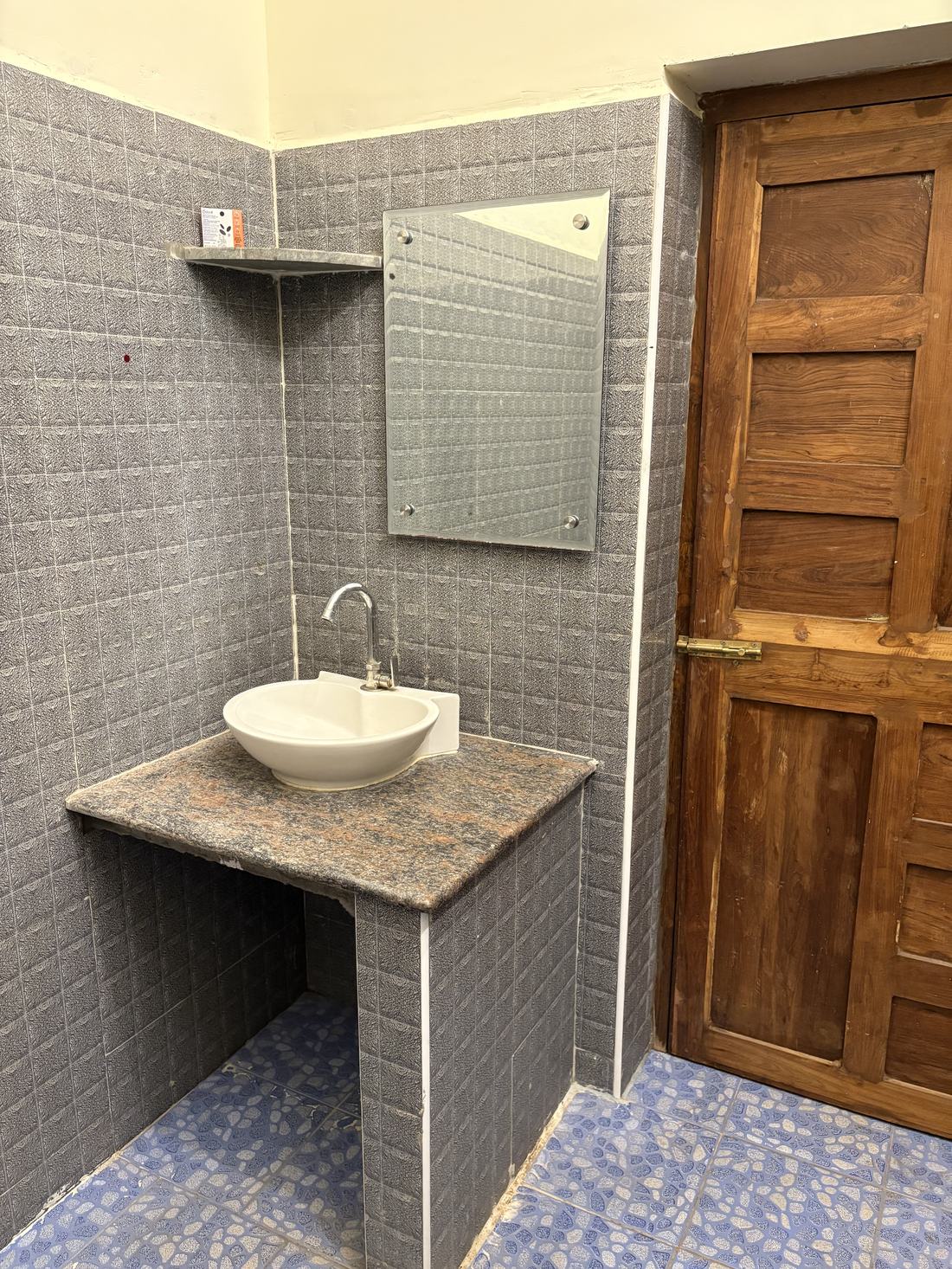 Room G6, Art Le Cafe Auroville — bathroom sink corner