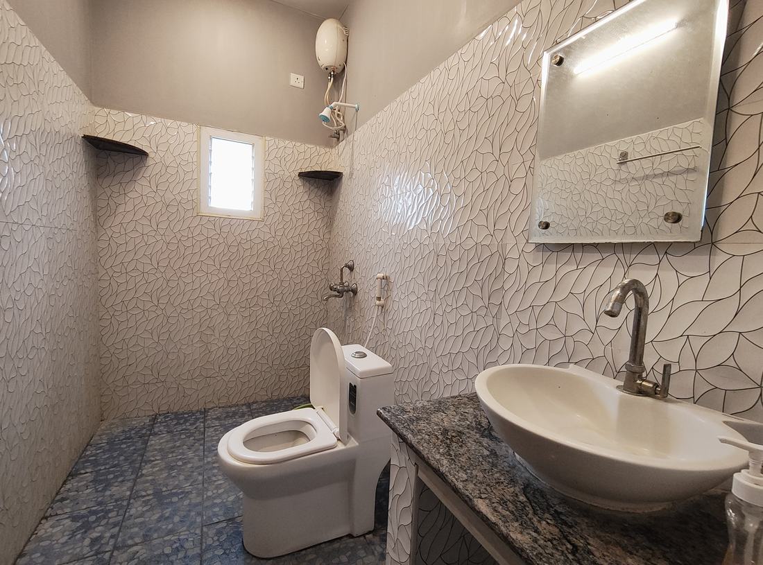 Agartha room F7, Art Le Cafe Auroville — bathroom with sink and toilet