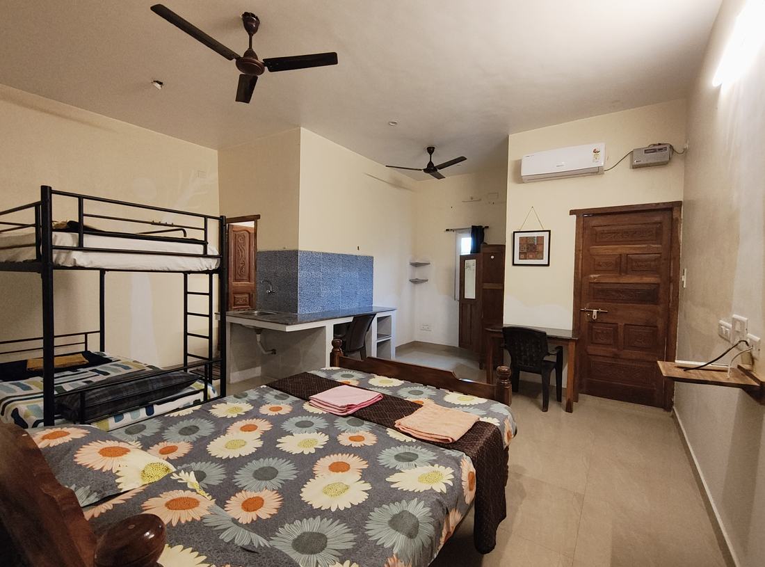 Arcadia room F8, Art Le Cafe Auroville — bunk bed, double bed and sink area