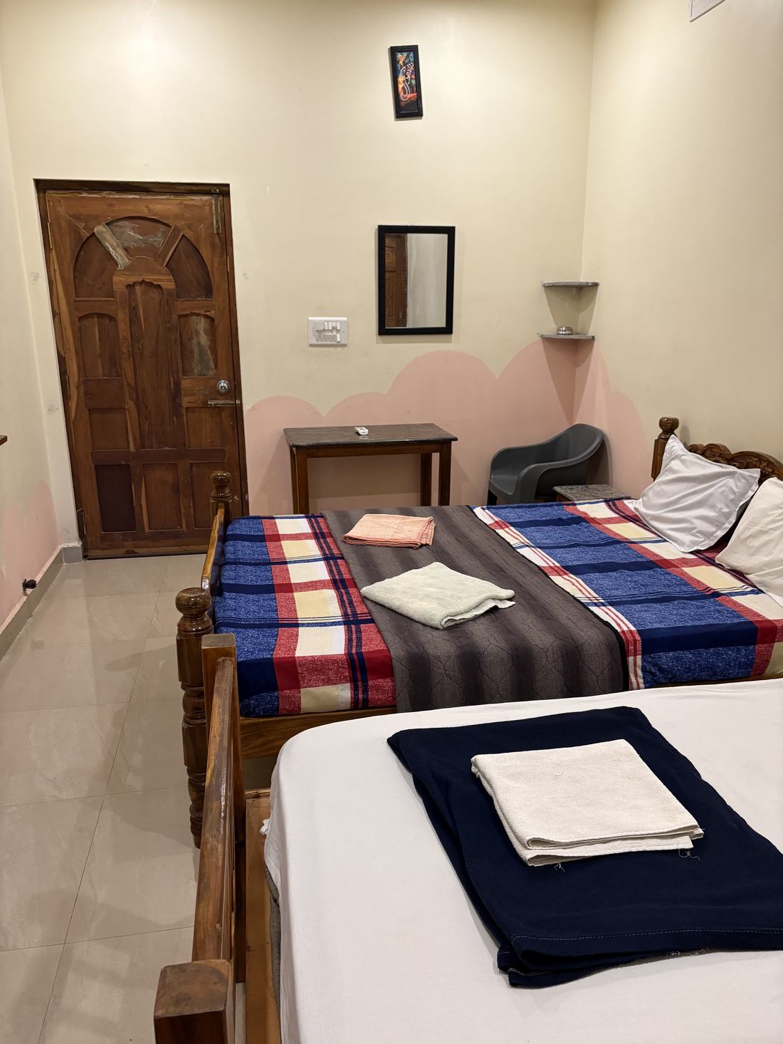 Atlantis room F9, Art Le Cafe Auroville — beds with towels laid out