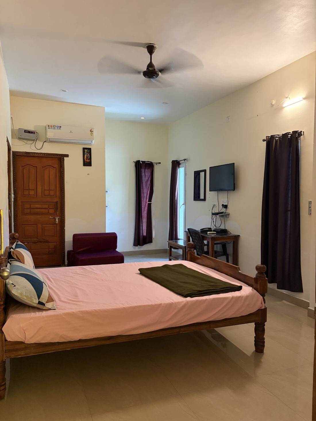 Brahmapura room F10, Art Le Cafe Auroville — bed, AC, desk and TV