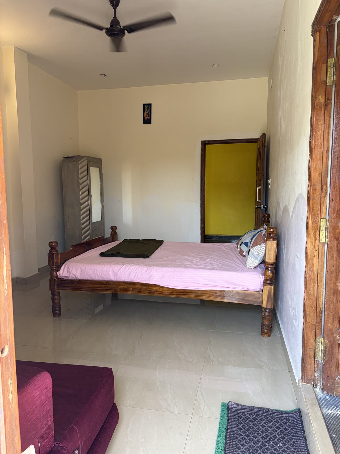 Brahmapura room F10, Art Le Cafe Auroville — bed and wardrobe