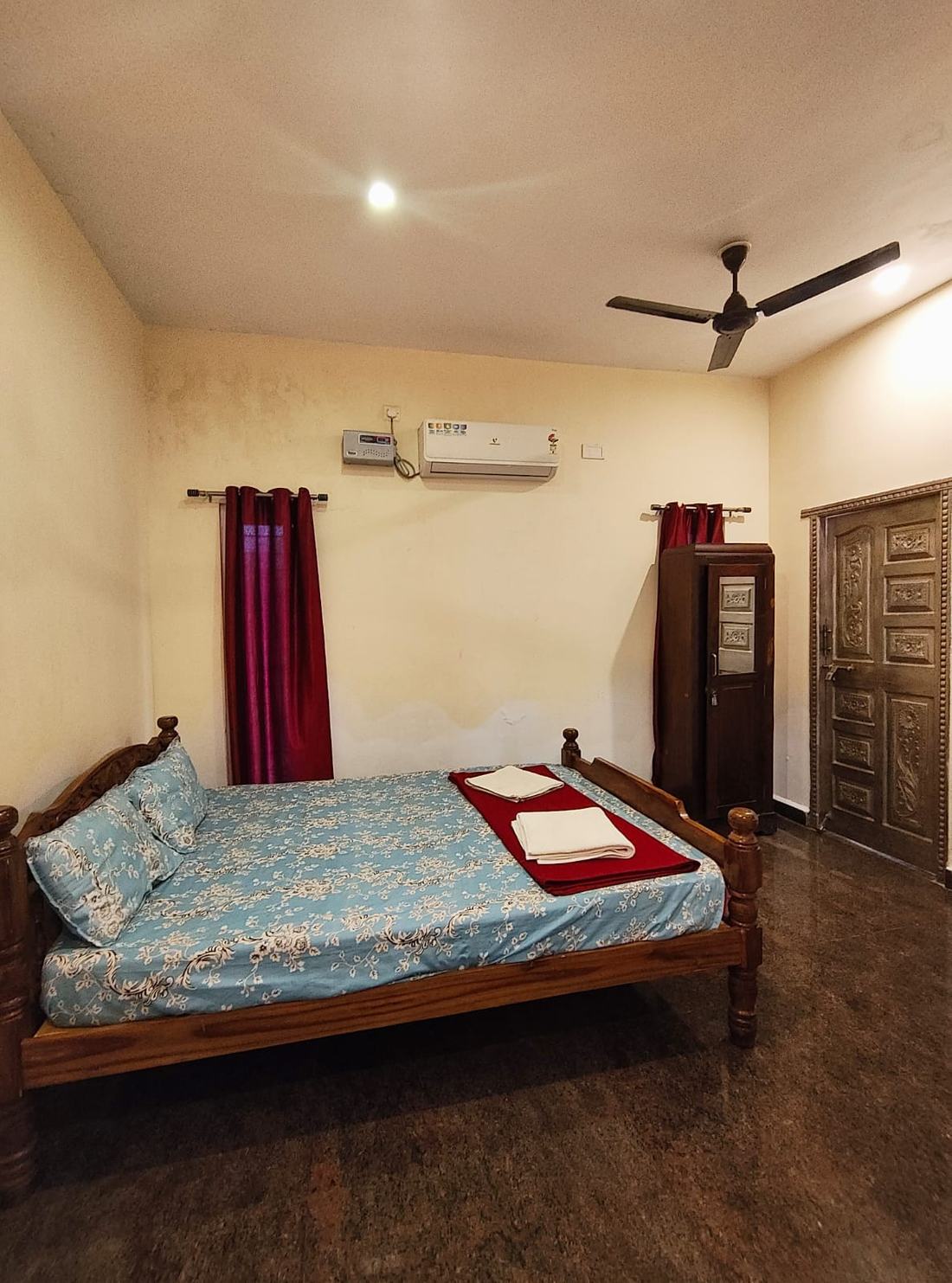 El Dorado room F12, Art Le Cafe Auroville — bed, AC and wardrobe