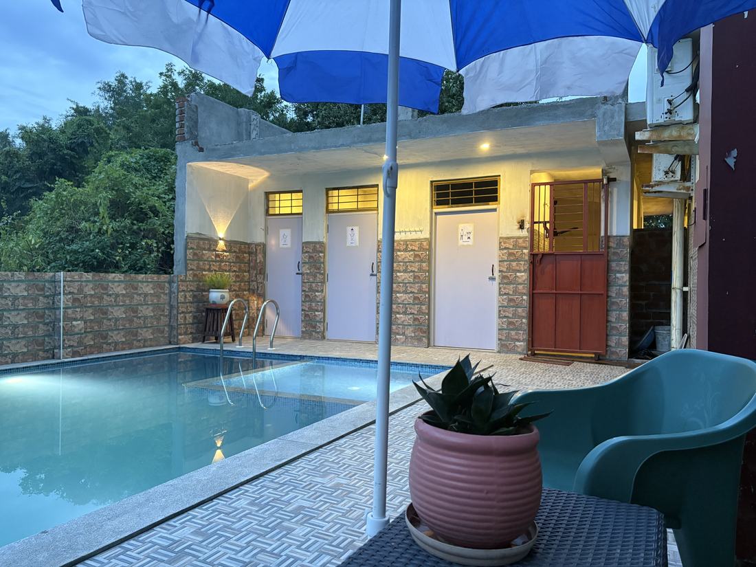 Shangri-La room F14, Art Le Cafe Auroville — pool area at dusk