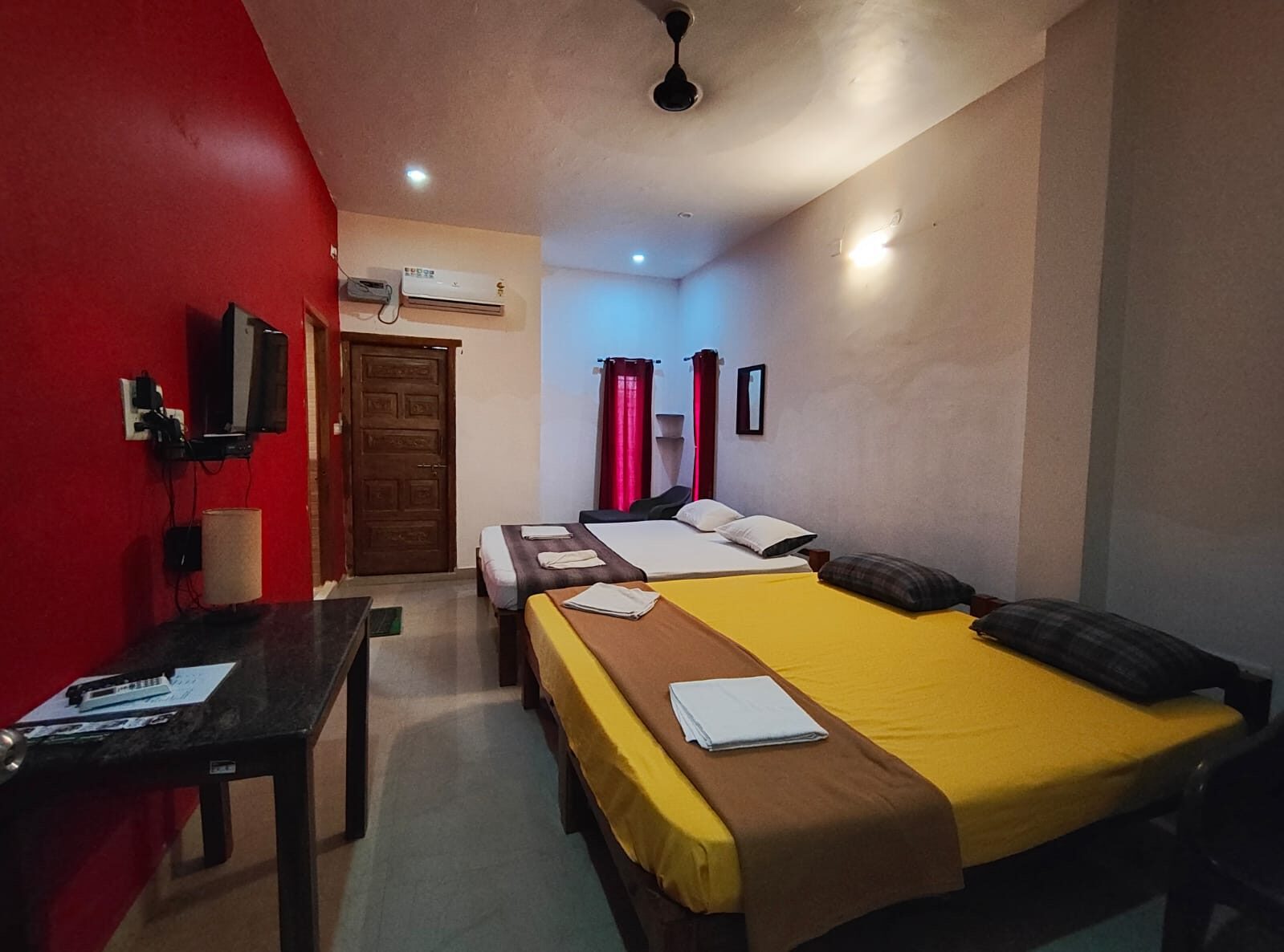 Dhruv room S20, Art Le Cafe Auroville — beds and TV
