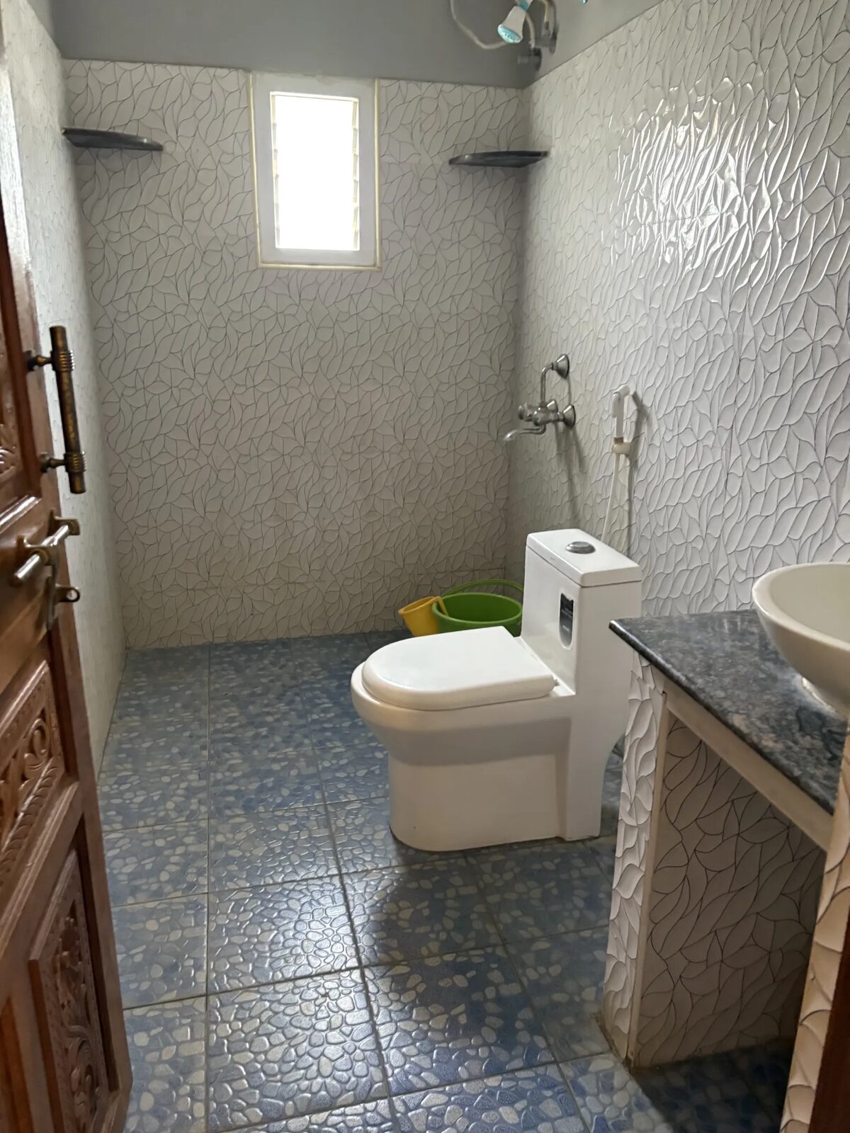 Dhruv room S20, Art Le Cafe Auroville — bathroom with sink and toilet