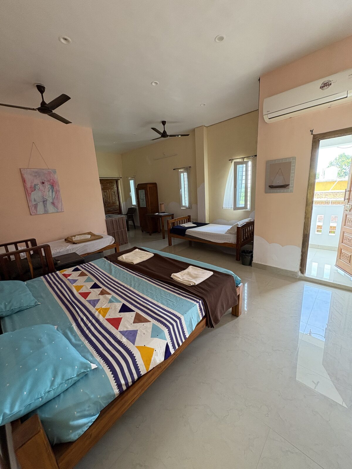 Aditya room S23, Art Le Cafe Auroville — beds and balcony door