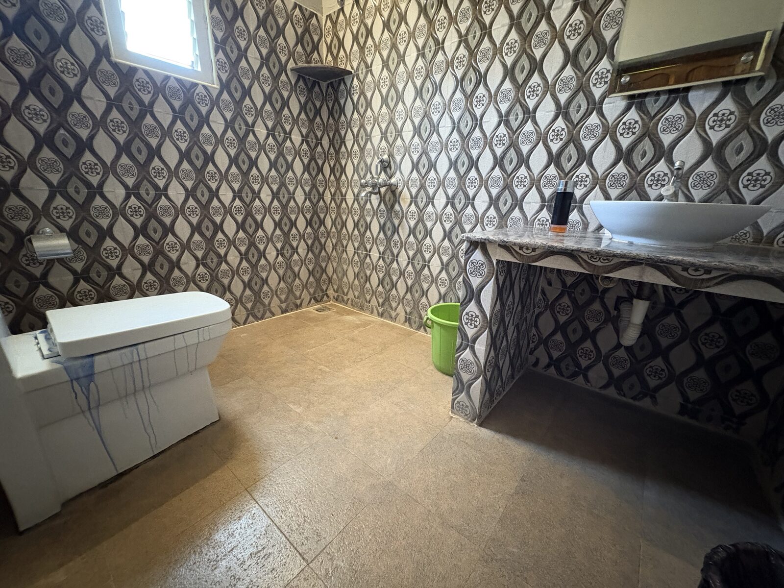 Kubera room S21, Art Le Cafe Auroville — bathroom with sink and toilet